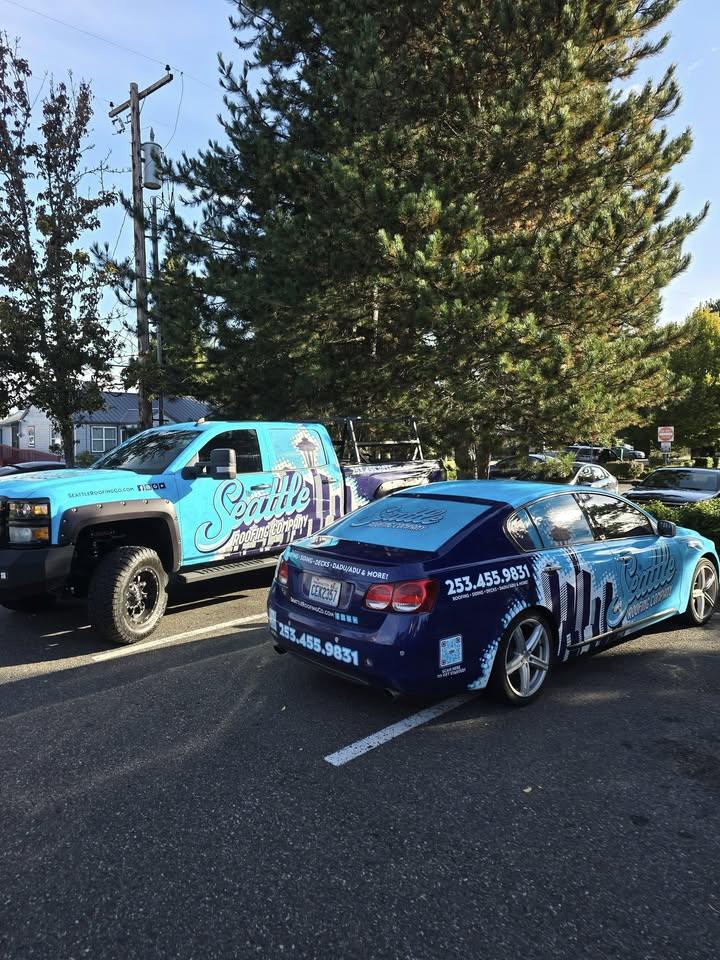 The Seattle Roofing Company team and fleet vehicles